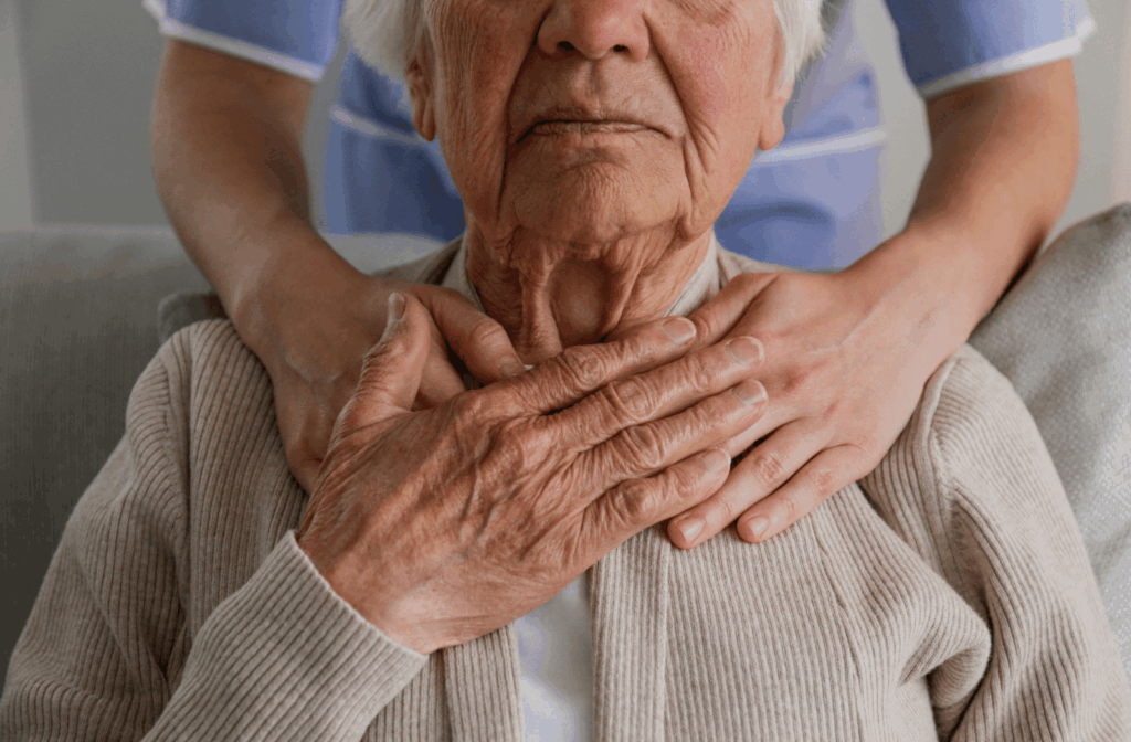A senior is comforted by their caregiver during a hallucination.