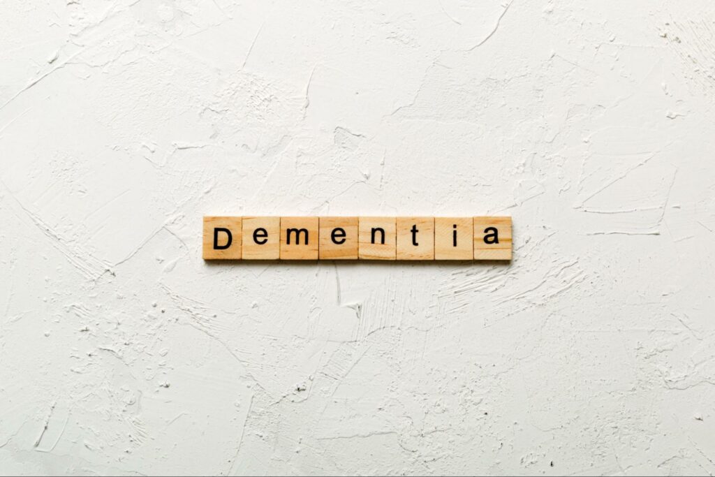 Word tiles spelling 'dementia' on a white background.