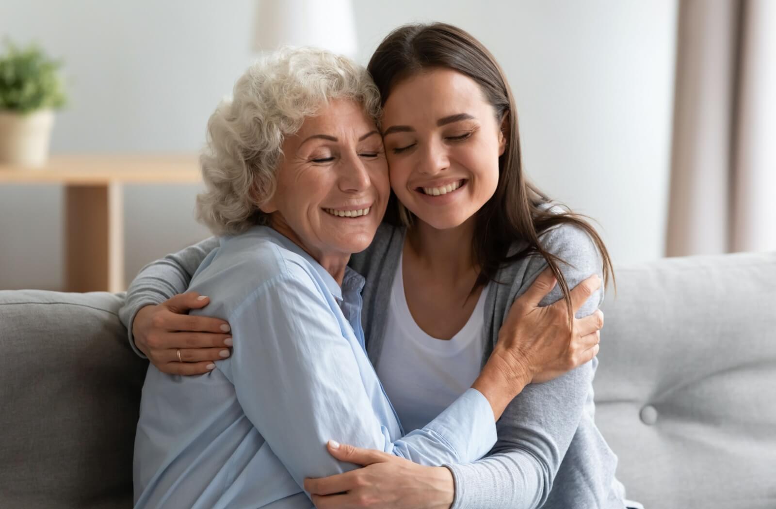 Someone hugs their mom while talking to them about their next steps in living arrangements.